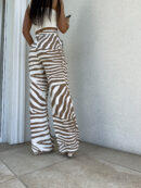 Spodnie SIMPLE print zebra - beżowa